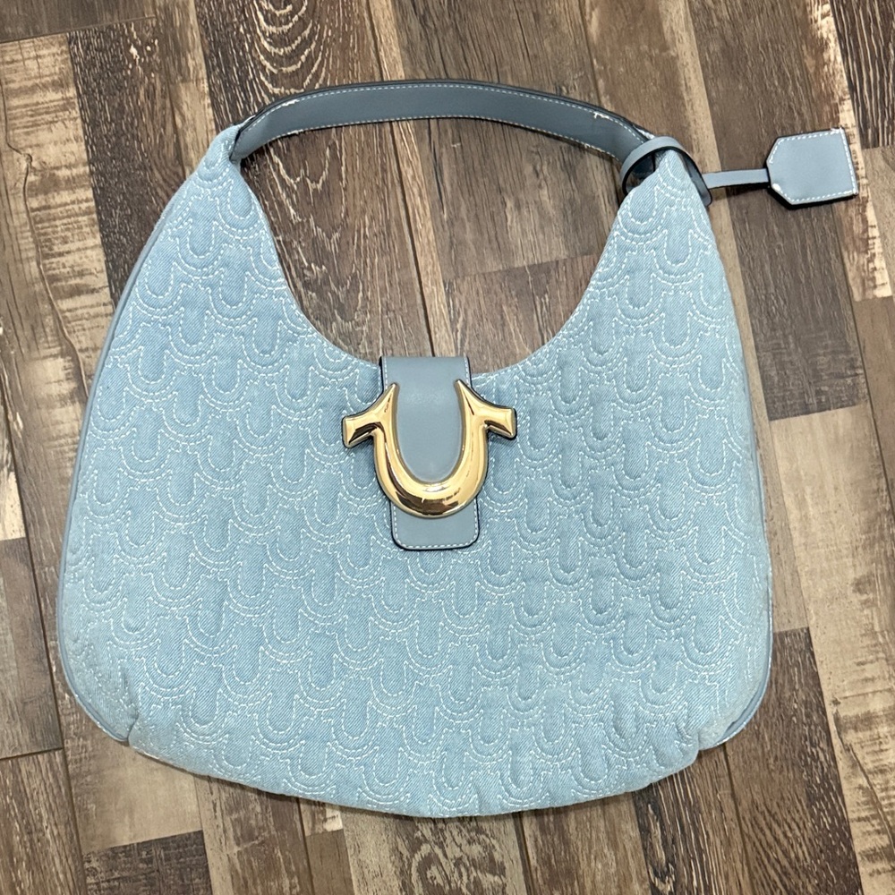 True Religion Light Blue Quilted Shoulder Bag with Gold Horseshoe Emblem